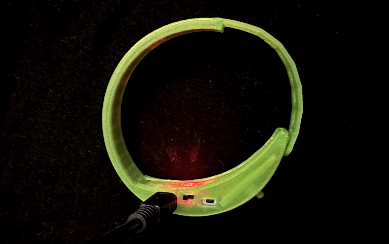 Wristband being charged via USB cable